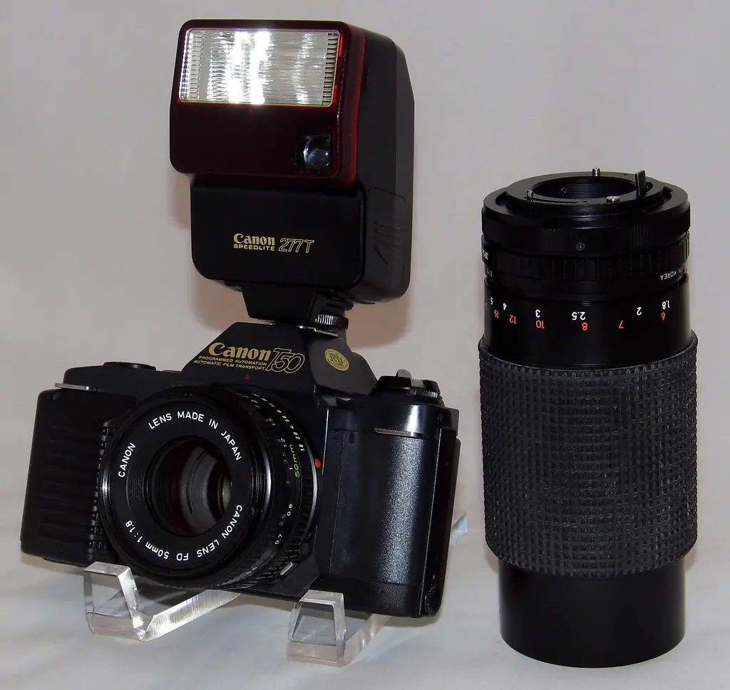 Vintage Canon T50 35mm SLR Camera With FD 50mm f/1.8 Lens And Canon Speedlite 277T Flash With An Albinar ADG 80-200mm Macro Zoom Lens, Made In Japan, Circa 1983 - 1989